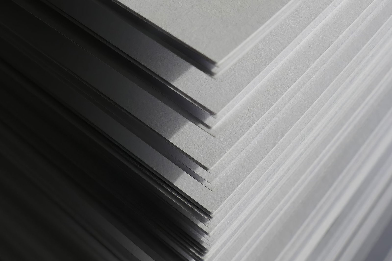 A tall stack of printed pages