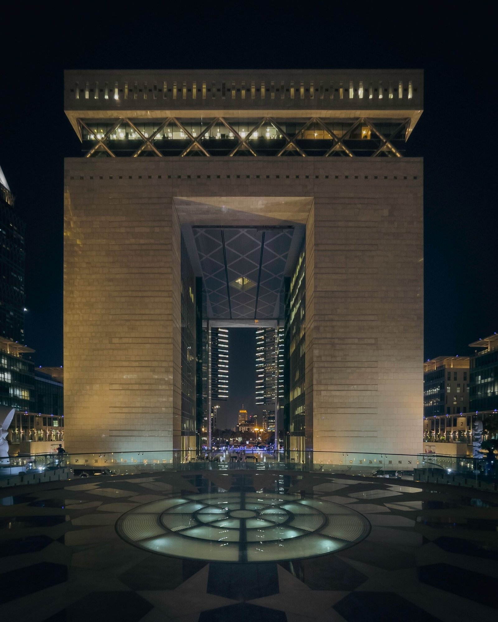 The floodlit DIFC Gate building at night