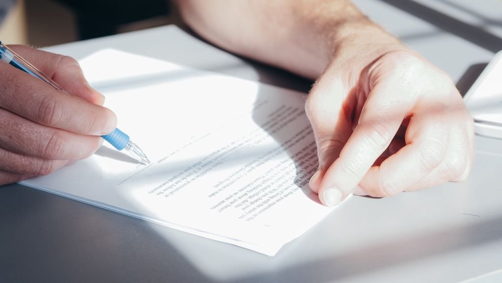 Two people reading a company document